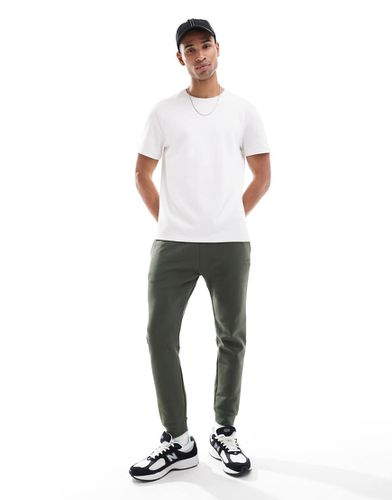 Pantalon de jogging fuselé technique - mousse foncé - Superdry - Modalova