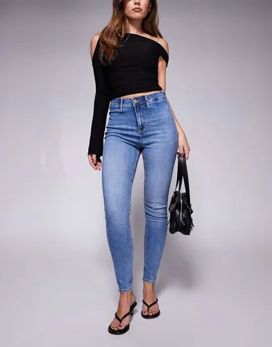 Jean skinny taille haute - délavé moyen - River Island - Modalova