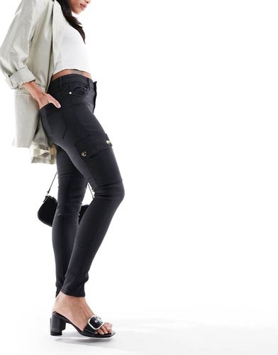 Pantalon cargo skinny enduit - River Island - Modalova