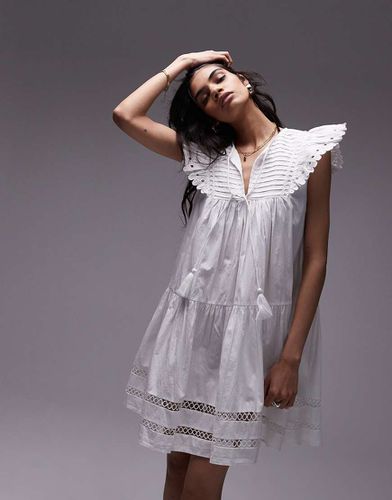 Robe courte en broderie anglaise à franges - Topshop - Modalova