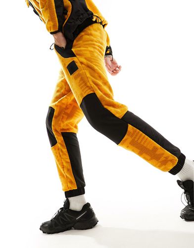 NSE Fleeski - Pantalon de jogging style années 2000 en polaire à imprimé numérique - The North Face - Modalova