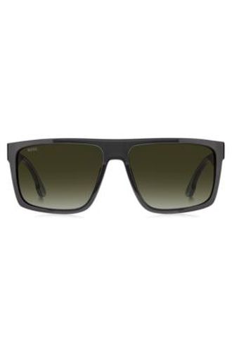 Lunettes de soleil noires mates avec incrustation argentée du logo - Boss - Modalova