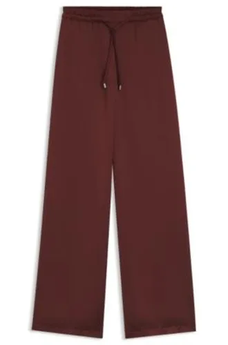 Pantalon Relaxed Fit en satin avec cordon de serrage à la taille - HUGO - Modalova
