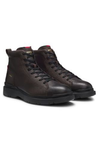 Bottines en cuir grainé avec logo en relief - HUGO - Modalova
