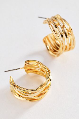 Boucles d'oreilles créoles en métal texturé en chez - Anthropologie - Modalova