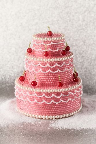 Pièce de cheminée en perles en forme de gâteau en Pink chez Anthropologie - Susan Alexandra - Modalova