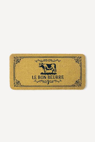Paillasson imprimé en fibre de coco Butter en Yellow chez - Anthropologie - Modalova