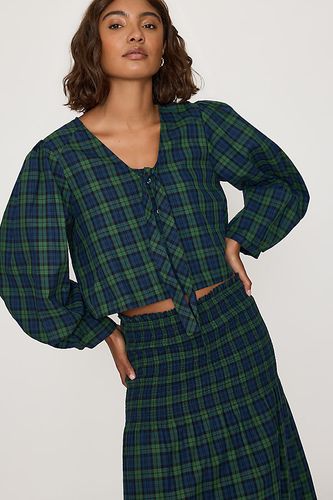 Chemisier à carreaux avec naud en taille: XS chez Anthropologie - The Tiny Big Sister - Modalova