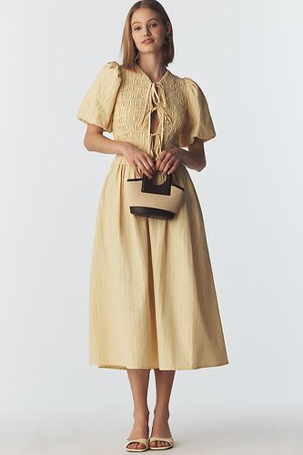 Robe midi Sara à manches bouffantes avec naud devant taille: XS chez Anthropologie - Extro & Vert - Modalova