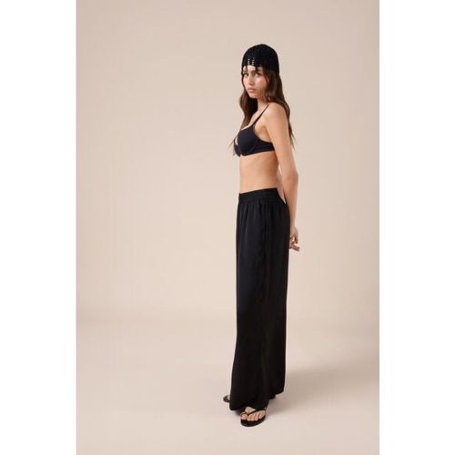 Pantalon palazzo brillant Taille M - Calzedonia - Modalova
