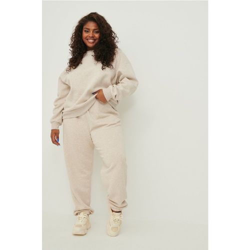 Pantalon de survêtement fuselé bio - Beige - NA-KD Trend - Modalova