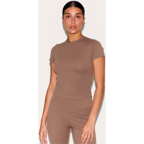 Petite Top de sport court en Sculpt à manches courtes - PrettyLittleThing - Modalova