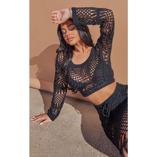 Petite Crop top en maille crochet à manches longues - PrettyLittleThing - Modalova