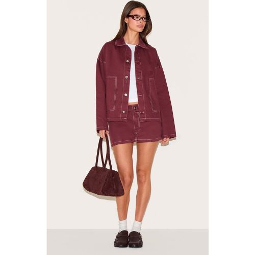 Mini-jupe en jean à coutures contrastantes - PrettyLittleThing - Modalova