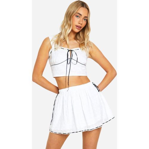 Mini-Jupe En Broderie Anglaise À Nœud Contrastant - 34 - boohoo - Modalova