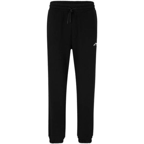 Bas de survêtement en coton Relaxed Fit avec logo manuscrit - HUGO - Modalova