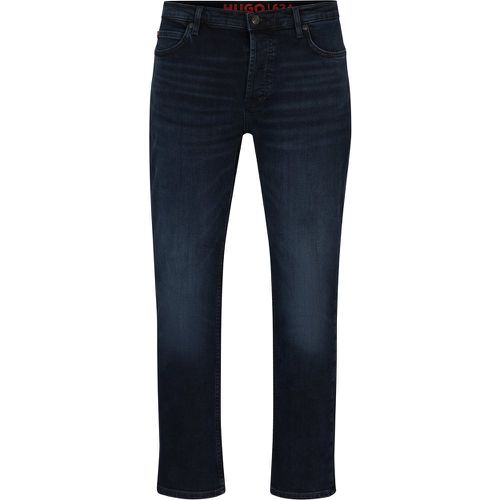 Jean Tapered Fit en denim bleu-noir - HUGO - Modalova