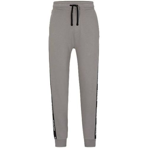 Pantalon de survêtement resserré au bas des jambes en coton biologique avec bande logo - HUGO - Modalova