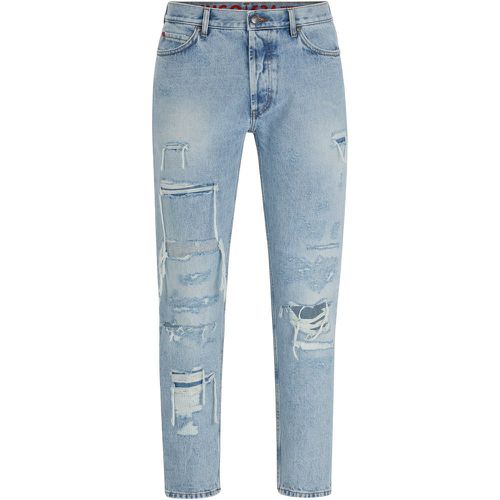 Jean Tapered Fit en denim bleu à détails effet usé - HUGO - Modalova