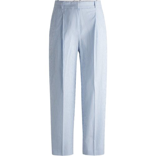 Pantalon décontracté en seersucker de coton stretch à rayures - Boss - Modalova