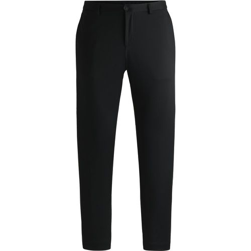 Pantalon Slim en jersey stretch performant à micro motif - Boss - Modalova