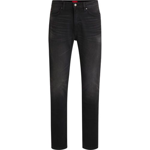 Jean Slim en denim stretch noir - HUGO - Modalova