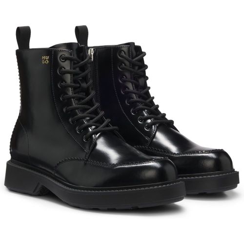 Bottines en cuir à lacets avec logo en creux - HUGO - Modalova