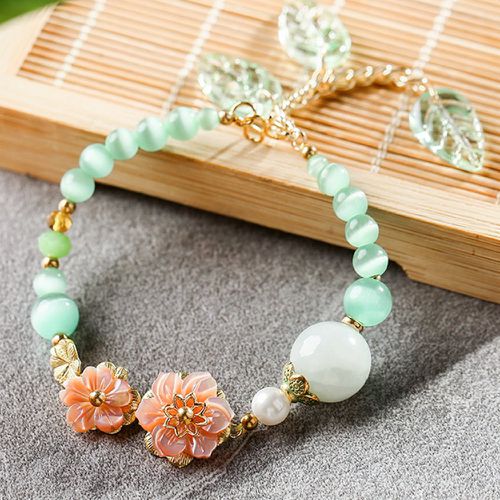 Bracelet perlé à fleur à détail feuille - SHEIN - Modalova