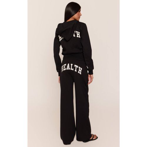 Black Jogging Ajusté Taille Basse À Imprimé Santé | Taille XS - PrettyLittleThing - Modalova