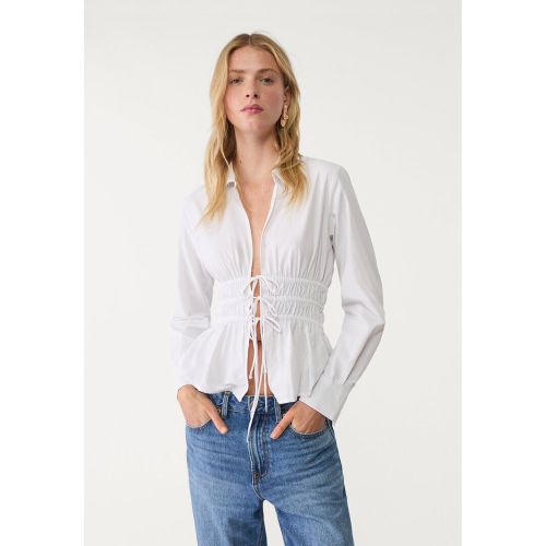 Chemise en popeline avec nœud sur le côté XS - Stradivarius - Modalova