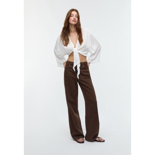 Blouse fluide à nœud XS - Stradivarius - Modalova