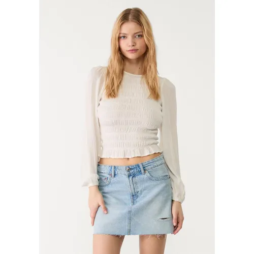 Jupe courte en jean DENIM BLEU CLAIR DÉLAVÉ 32 - Stradivarius - Modalova