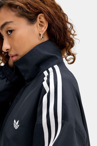 Haut de survêtement noir super ample en taille: Small - adidas Originals - Modalova