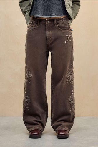 Jeans brodés dragon exclusif UO en taille: XS - Ed Hardy - Modalova
