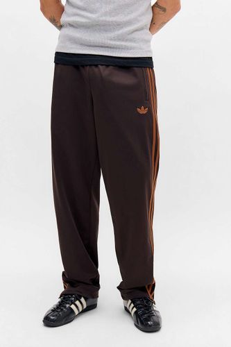Pantalon de survêtement Firebird marron Originals en taille: Small - adidas - Modalova