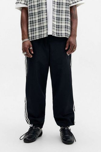 Pantalon de survêtement Firebird noir en taille: Small - adidas Originals - Modalova