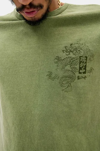 T-shirt graphique dragon éclaboussé UO par en taille: XS - Urban Outfitters - Modalova
