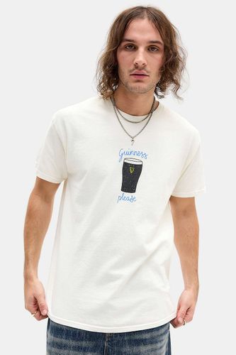 T-shirt graphique UO Guinness Please par en taille: XS - Urban Outfitters - Modalova