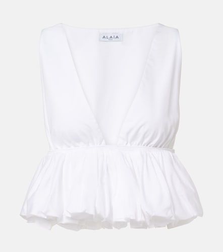 Alaïa Top péplum en coton - Alaia - Modalova