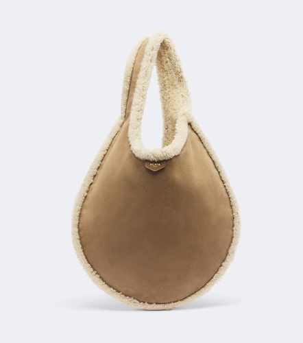 Alaïa Sac One Piece en daim et shearling - Alaia - Modalova