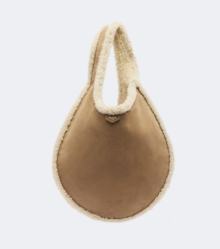 Alaïa Sac One Piece en daim et shearling - Alaia - Modalova