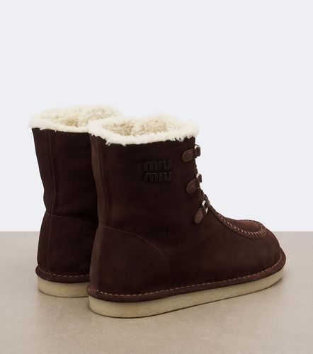 Bottines en daim et shearling - Miu Miu - Modalova