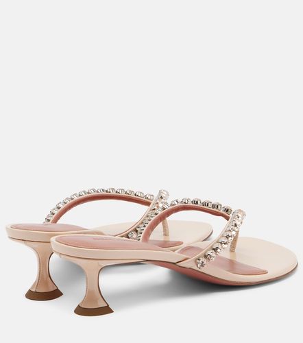 Mules Gigi en cuir à ornements - Amina Muaddi - Modalova