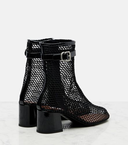Alaïa Bottines en résille et cuir verni - Alaia - Modalova