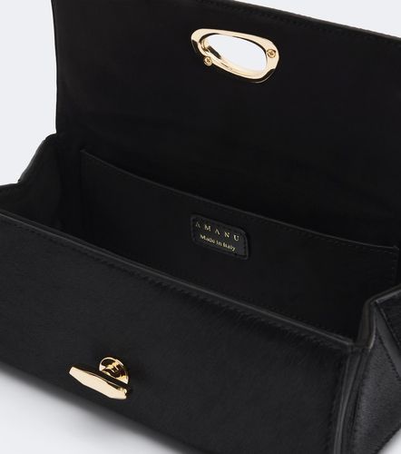 Pochette Tanzania en cuir façon poulain - Amanu - Modalova