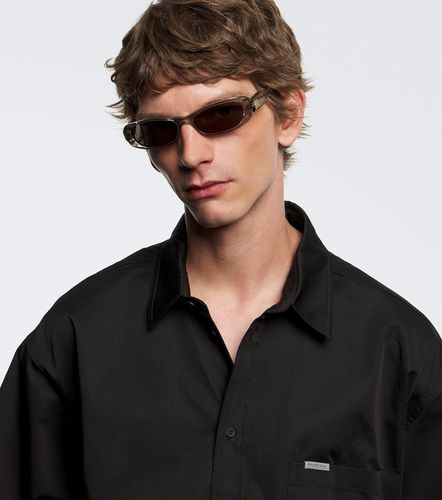 Lunettes de soleil ovales à logo - Balenciaga - Modalova