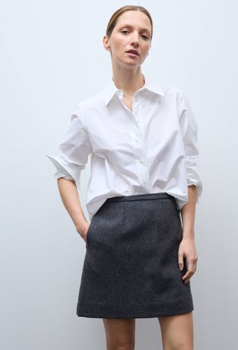 Jupe courte unie contenant de la laine - MONOPRIX - Modalova