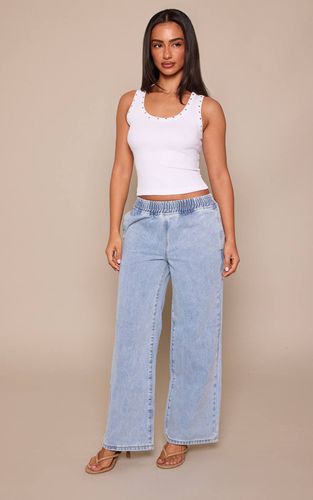 Jean Petite À Jambes Larges Et Taille Élastiquée | Taille 30 - PrettyLittleThing - Modalova