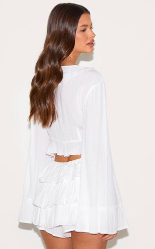 White Top À Manches Longues En Gaze De Coton Avec Volants Et Lien Noué Devant | Taille 42 - PrettyLittleThing - Modalova