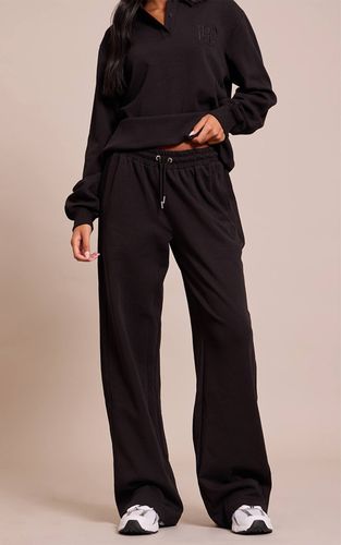 Black Jogging Grande Taille À Jambes Larges Avec Panneaux Côtelés Et Broderies Entrelacées | Taille XS - PrettyLittleThing - Modalova